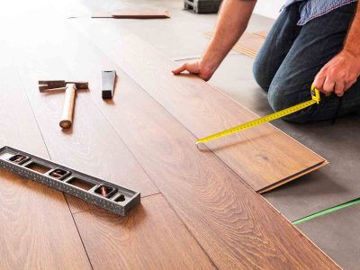 homeguide-worker-installing-new-flooring-in-home